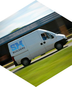 SM Builders white van driving in Wrexham